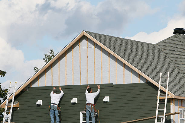 Professional Storm Damage Siding Repair technician working in Tolland, CT
